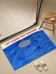 Detail showing absorbent diatomite bath mat with GET UNDER THE SHOWER text on floor