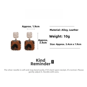 Detail view of leopard print faux leather square earrings with alloy edges and dimensions