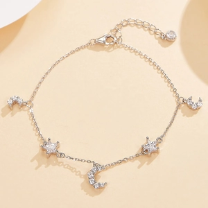 Elegant S925 sterling silver bracelet with sparkling zircon moon and star pendants