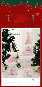Close-up of pink sequined Christmas dolls with telescopic legs and snowflake embroidery