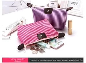 Detail of striped canvas makeup bags showing large capacity for cosmetics and skin care