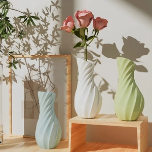 Modern spiral textured flower vase in light blue, white and green for home decor