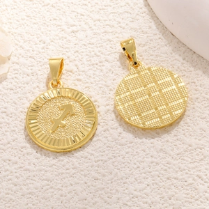 Golden Sagittarius zodiac coin pendant with grid texture back on beige background
