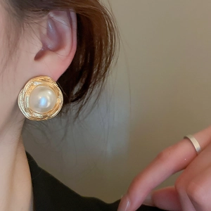 Vintage gold textured spiral earrings with a large faux pearl in a stylish French design