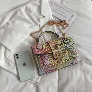 Summer transparent jelly bag with colorful graffiti, gold rivets, and chain strap