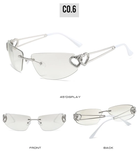 Détail de lunettes de soleil sans monture avec décor de branches en double cœur métal