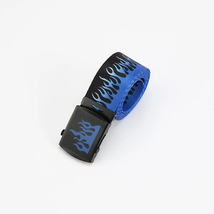 Detail view of a blue and black canvas belt with flame patterns rolled on a white surface
