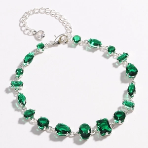Silver fashion bracelet with diverse green zircon crystals and lobster clasp