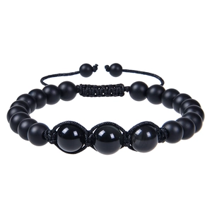 Detail of adjustable braided bracelet with matte onyx beads and polished center accents