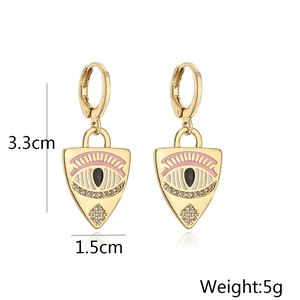 Detail of 18K gold evil eye earrings featuring pink lashes and dimension specs