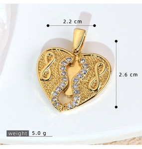 Macro shot of micro-pave zircon heart wing pendant with dimensions 2.2cm and 2.6cm