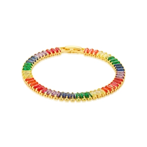 Macro detail of gold-plated bracelet featuring rainbow rectangular cubic zirconia stones