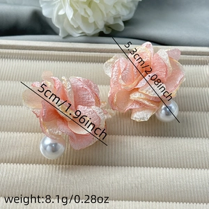 Macro detail of pink lace flower earrings with white pearl drop and size measurements