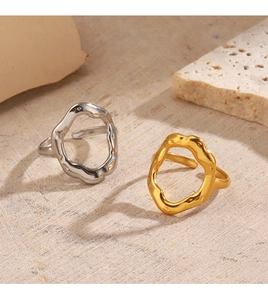 Detail of minimalist 18K gold and silver plated irregular lava-style open rings