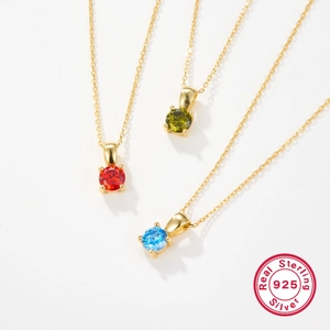 Sterling silver birthstone necklace with red green and blue zircon pendants