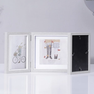 Nordic style triple folding wood photo frame for 4x6 and 5x7 inch pictures on white desk
