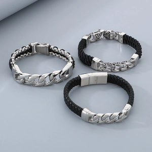 Detailed view of three vintage stainless steel magnetic clasps on leather bracelets