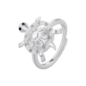 Macro shot of a silver sea turtle ring with cubic zirconia inlay and adjustable band