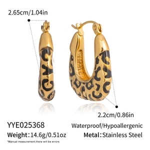 Detail view of leopard print gold earrings with dimensions and material specifications