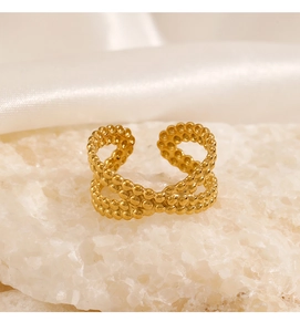 Macro detail of gold-plated stainless steel double-layer cross ring with bubble texture on stone