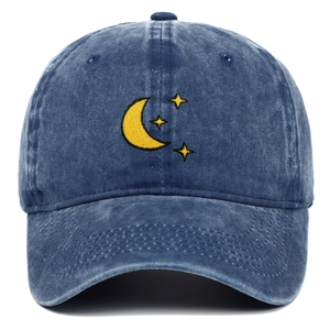 Blue washed denim baseball cap with yellow moon and stars embroidery on white background