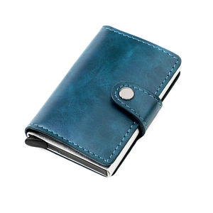 Detail of blue textured leather RFID wallet with silver aluminum card ejector and button