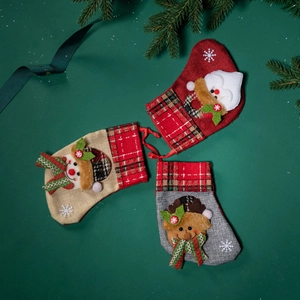 Set of 3 Christmas stockings with Santa Snowman and Reindeer on green background