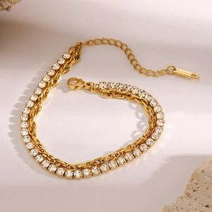 Elegant gold double-layer stainless steel bracelet featuring a pavé diamond tennis chain