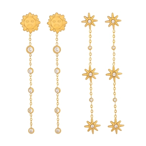 Golden sun and starburst tassel earrings with sparkling cubic zirconia on a white background
