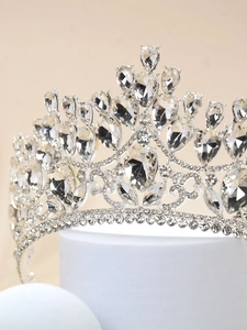 Close-up of intricate silver metal bridal crown featuring sparkling crystal details