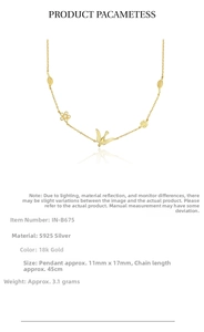Detail of 925 sterling silver bird and flower necklace with 18k gold plating details