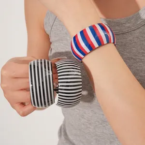 Striped wide open bangle bracelets in acrylic with bold pop art patterns for women