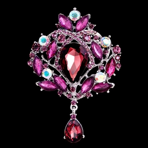Detail of vintage style brooch with purple teardrop crystals and silver alloy base
