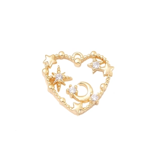 Golden heart pendant featuring star and moon motifs with zircon inlay on white background