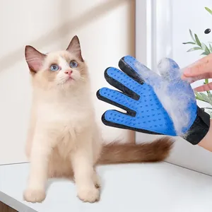 Blue silicone pet grooming glove for cats and dogs removing loose fur during massage
