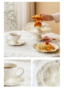 Detail of white embossed floral ceramic tableware set with cake stand and tea cups