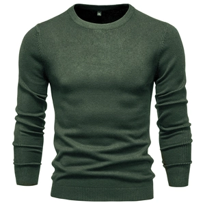 Close-up of dark green crewneck sweater showing fine knit texture and neckline detail