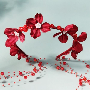Exaggerated pearl tassel headband with deep red silk flowers for festive party hairstyles