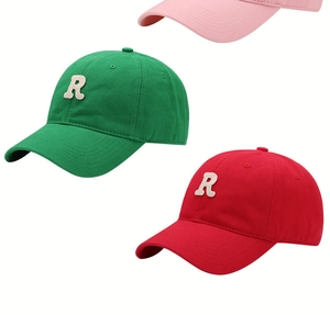 Close-up of baseball cap featuring a beige chenille letter R patch on cotton fabric