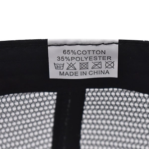 Detailed fabric label of the mesh cap showing 65% cotton and 35% polyester material