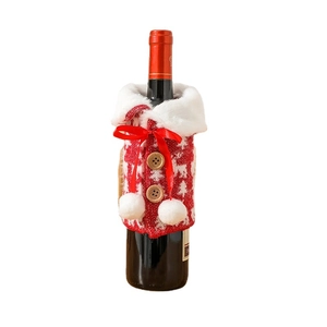 Knitted Christmas wine bottle cover with elk pattern and faux fur trim on white background