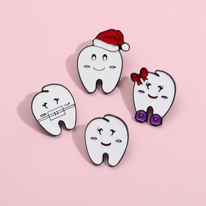 Cartoon tooth enamel pin set with toothbrush and braces theme on pink background