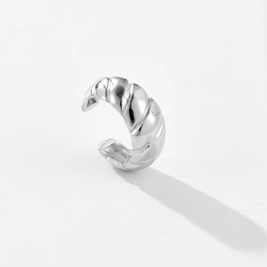Detail of s925 silver croissant ear cuff with twisted texture and polished silver finish