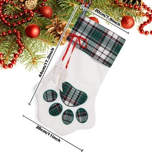 Christmas stocking with red and green plaid pet paw design and festive decor