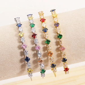 Detail of gold-plated bracelets featuring square and marquise-cut colorful zircons