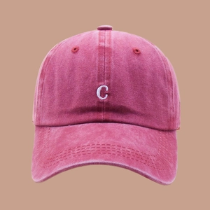 Detailed front view of washed cotton baseball cap with white C letter embroidery