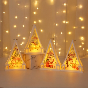 Detail of white Christmas LED lanterns with warm lights and festive tree patterns