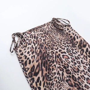 Close-up of leopard print bikini bottom with stylish side tie straps on white background