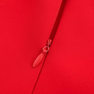 Detail of red balloon mini dress featuring a high-quality invisible back zipper closure