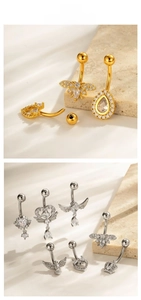 Macro detail of micro-pave zircon belly rings with stainless steel bars and screw closures